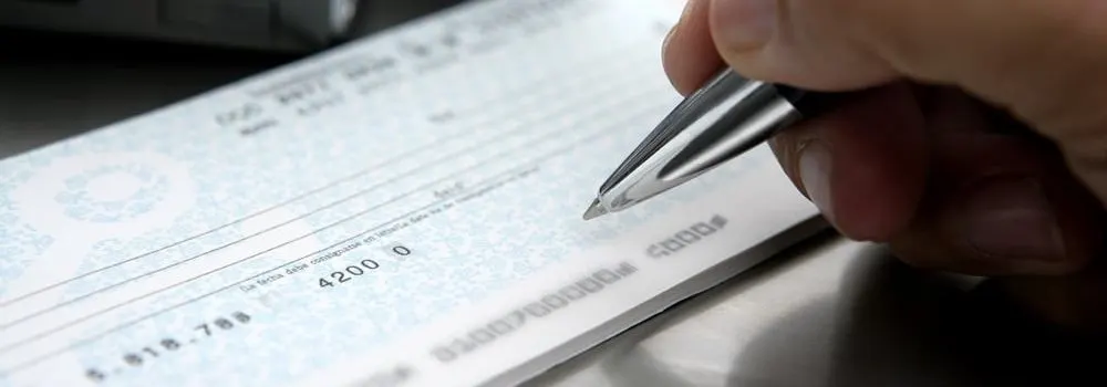 Business cheque being completed